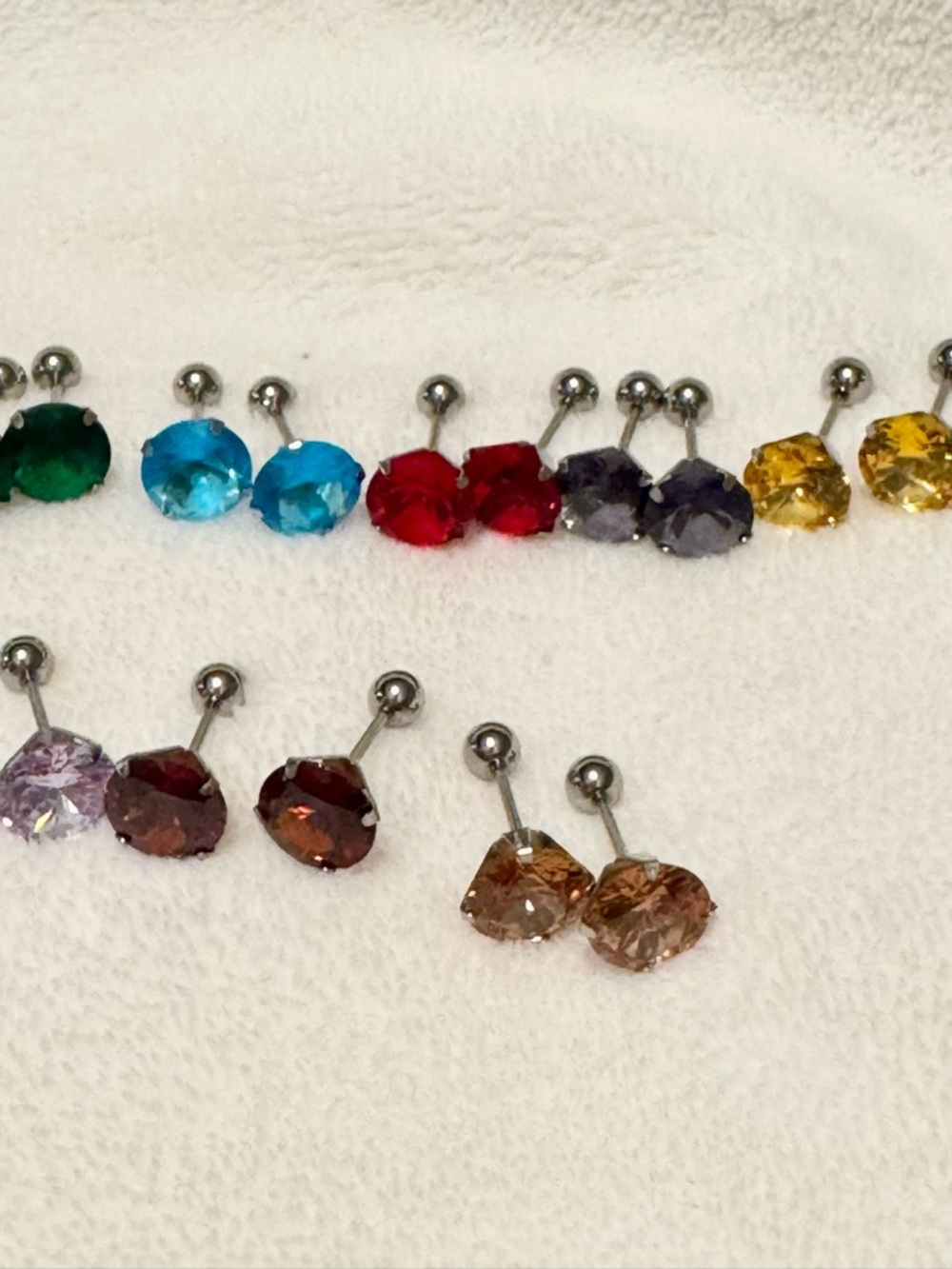 9 pairs of stainless steel screw on earrings